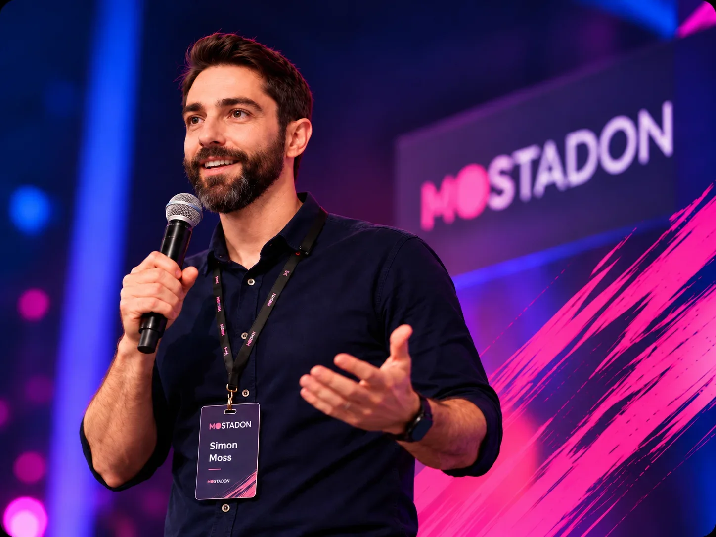 Simon Moss speaking on stage at a MOSTADON event